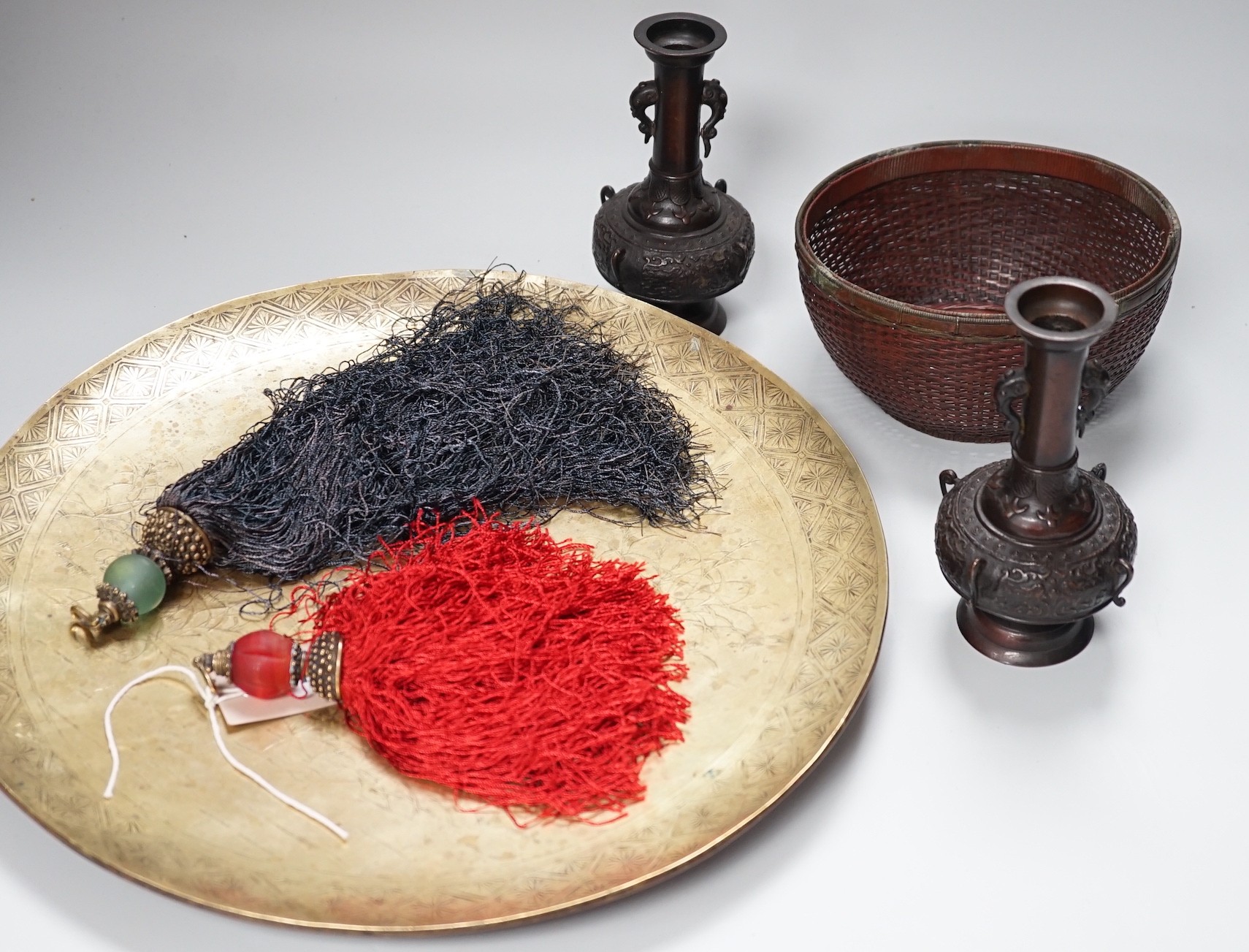 A Japanese Meiji period polished bronze dish, two hanging scroll weights, a mixed metal basket and a pair of bronze vases, dish diameter 37cm